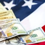 US dollar banknote on USA flag background.US dollar is main and