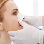Close up of womans face with a medical dressing